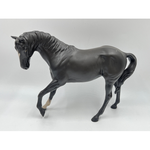 345 - Three ceramic horse figurines, Beswick Springtime, Beswick Sunlight and Royal Doulton Black Beauty