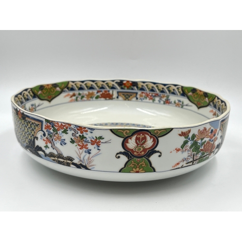 347 - A Japanese porcelain circular footed bowl - approx. 27cm diameter