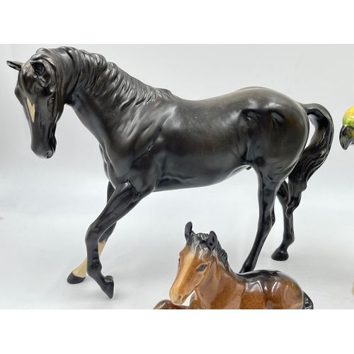 349J - Three Beswick figurines, no. 930 Parakeet, no. 915 Foal and no. 2466 Black Beauty