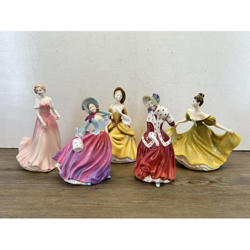 374 - Five Royal Doulton figurines, Pretty Ladies Autumn Breeze - HN 4716, Christmas Morn - HN 1992, Lynne... 