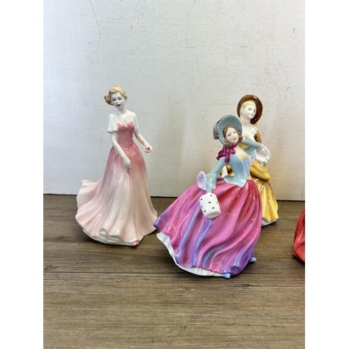 374 - Five Royal Doulton figurines, Pretty Ladies Autumn Breeze - HN 4716, Christmas Morn - HN 1992, Lynne... 