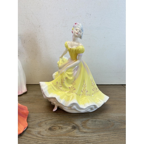 378 - Five Royal Doulton figurines, Strolling - HN 3755, Pretty Ladies Fragrance - HN 4931, Coralie - HN 2... 