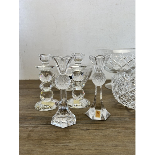 390 - A collection of glassware to include two pairs of Nachtmann candlesticks, circular pedestal bowl etc... 