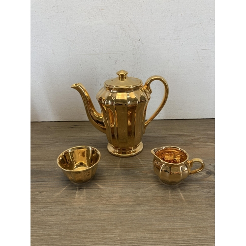 350 - Seventeen pieces of Wade pottery, Gold Lustre fourteen-piece coffee set and Rubytone three-piece tea... 