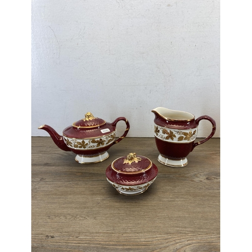 350 - Seventeen pieces of Wade pottery, Gold Lustre fourteen-piece coffee set and Rubytone three-piece tea... 