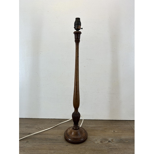 595A - An early 20th century carved mahogany table lamp - approx. 61cm high