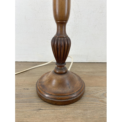 595A - An early 20th century carved mahogany table lamp - approx. 61cm high