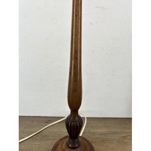 595A - An early 20th century carved mahogany table lamp - approx. 61cm high