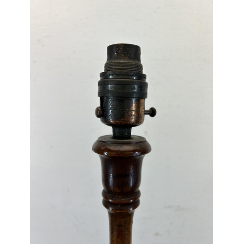 595A - An early 20th century carved mahogany table lamp - approx. 61cm high