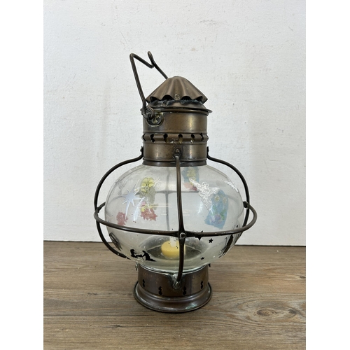 599 - An early 20th century copper and brass ship's lantern - approx. 31cm high