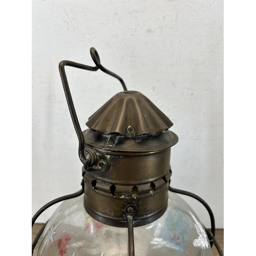 599 - An early 20th century copper and brass ship's lantern - approx. 31cm high