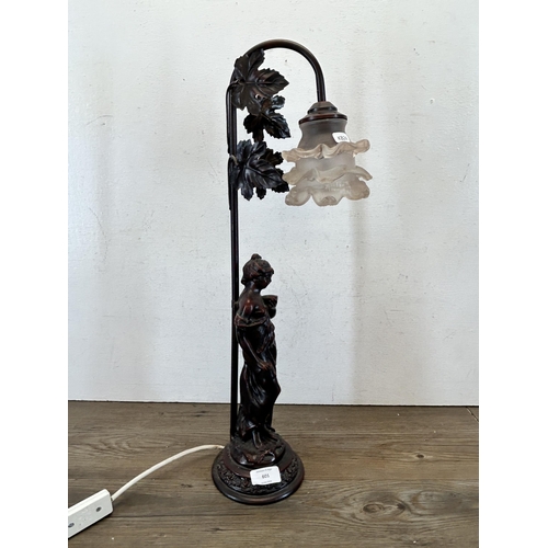 601 - A bronzed resin figural table lamp with artist's signature to base