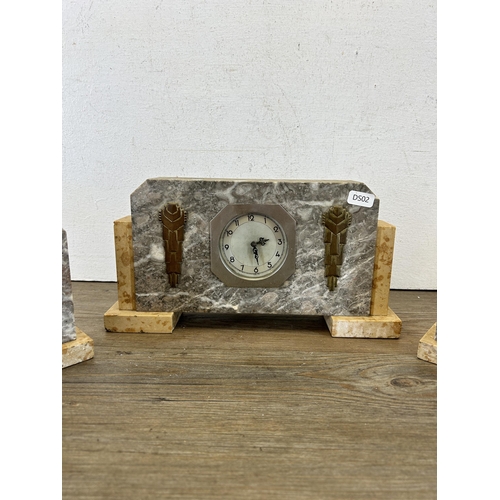 605 - An Art Deco marble and brass mantel clock with pair of matching garnitures