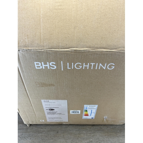 609 - A boxed BHS Lighting brass effect chandelier