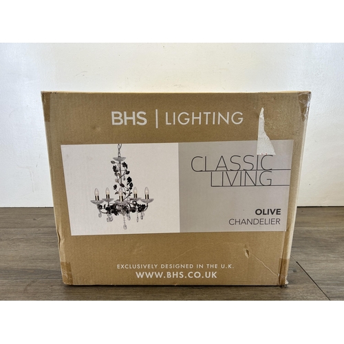 610 - A boxed BHS Lighting brass effect chandelier