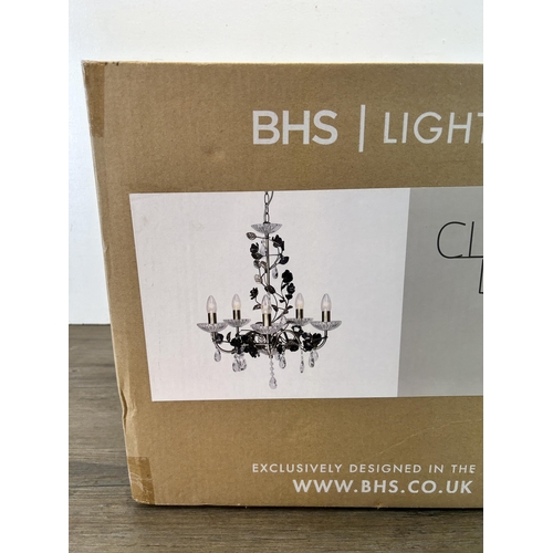 610 - A boxed BHS Lighting brass effect chandelier