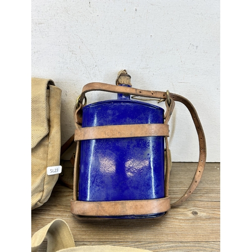 614 - Two pieces of British Army militaria, one WWI 1914 Pattern cobalt blue enamel water canteen - approx... 