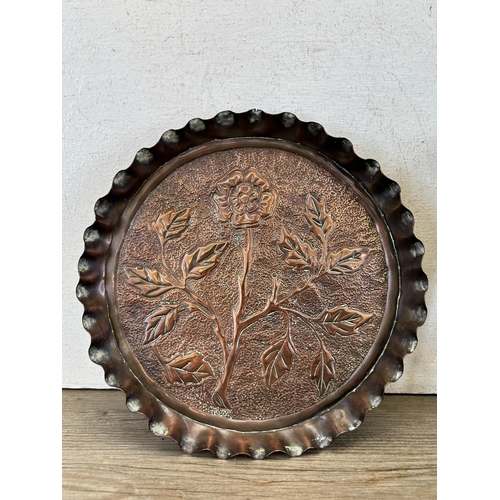 617 - Two pieces of metalware, one antique copper circular plate with floral design - approx. 25cm diamete... 