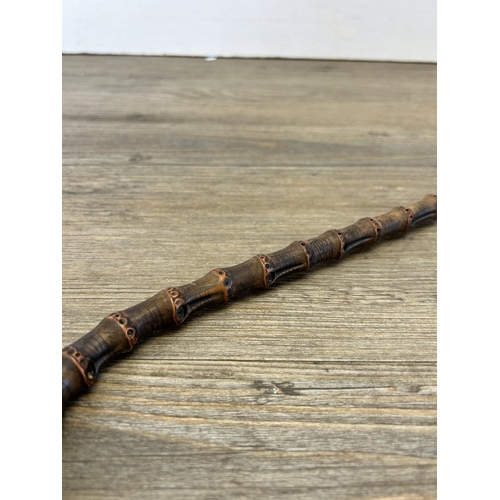 622 - A Victorian bamboo walking cane - approx. 85cm long