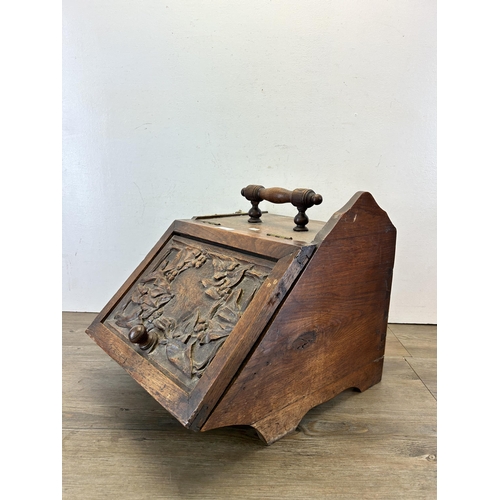 638 - A late 19th/early 20th century carved oak coal scuttle - approx. 48cm high x 36cm wide x 42cm deep