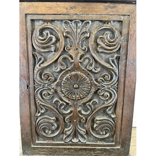 639 - A Georgian heavily carved oak spice cabinet - approx. 56m high x 43cm wide x 19cm deep