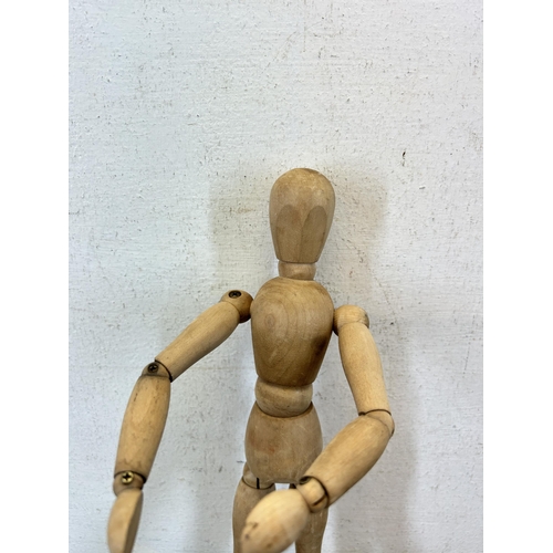 653 - A beech artist's lay figure - approx. 30cm high