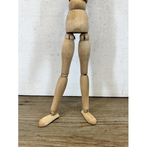 653 - A beech artist's lay figure - approx. 30cm high