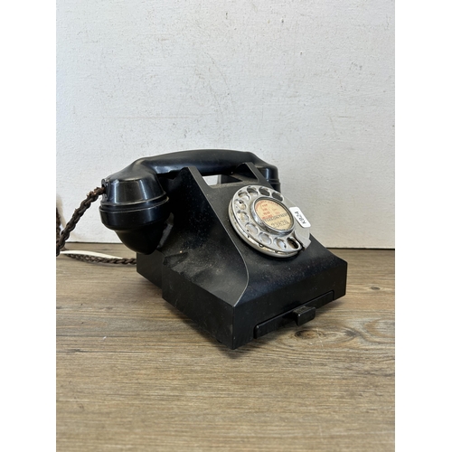 657 - A vintage black Bakelite rotary dial telephone - model no. 332L TE59/2A