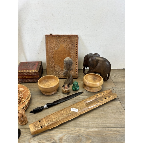 662 - A collection of items to include carved hardwood elephant figurine, carved malachite Ganesha figurin... 