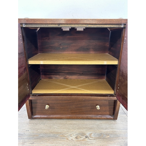 664 - A mid 20th century mahogany two door cabinet with lower drawer - approx. 55cm high x 49cm wide x 29c... 