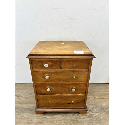 679 - An early 20th century mahogany and satinwood apprentice chest of drawers - approx. 34cm high x 27cm ... 