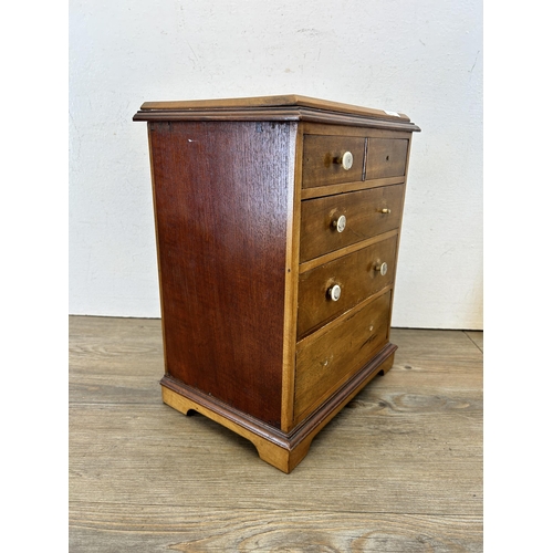 679 - An early 20th century mahogany and satinwood apprentice chest of drawers - approx. 34cm high x 27cm ... 