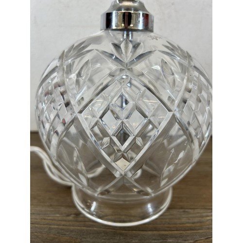 596 - A mid 20th century cut glass table lamp - approx. 23cm high