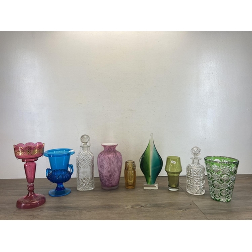 415 - Nine pieces of glassware to include Victorian cranberry glass lustre vase, Bohemian green cut glass ... 