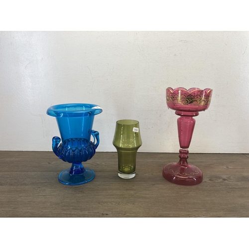 415 - Nine pieces of glassware to include Victorian cranberry glass lustre vase, Bohemian green cut glass ... 