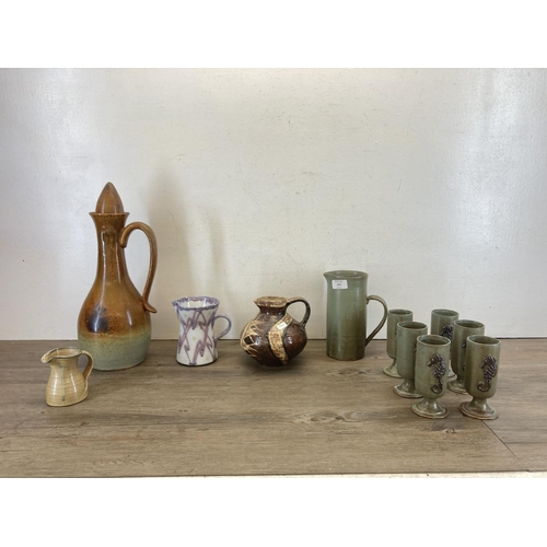 416 - Eleven pieces of studio pottery to include Lower Mill Studio Jersey seven-piece drinking set, purple... 