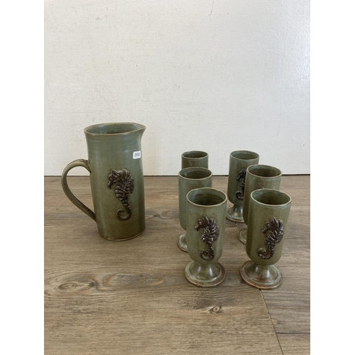 416 - Eleven pieces of studio pottery to include Lower Mill Studio Jersey seven-piece drinking set, purple... 