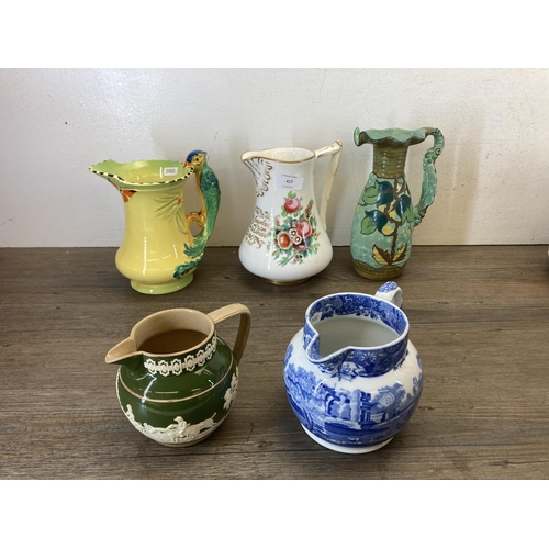 417 - Twelve 19th century and later ceramic jugs to include Art Deco Burleigh Ware parrot, Victorian Josep... 