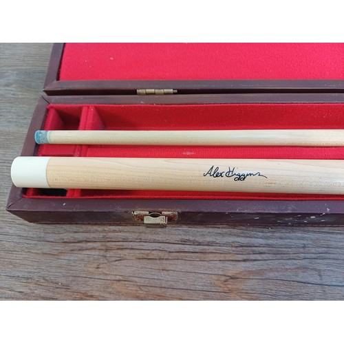 640A - A cased BCE Alex Higgins signature two-piece snooker cue