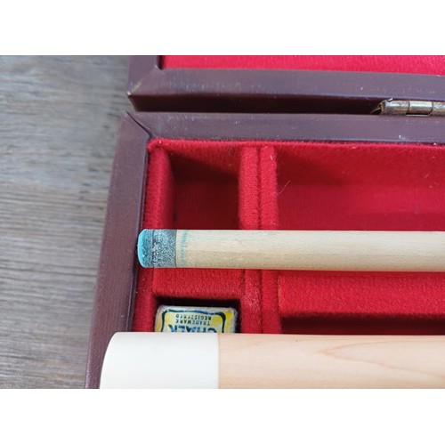 640A - A cased BCE Alex Higgins signature two-piece snooker cue