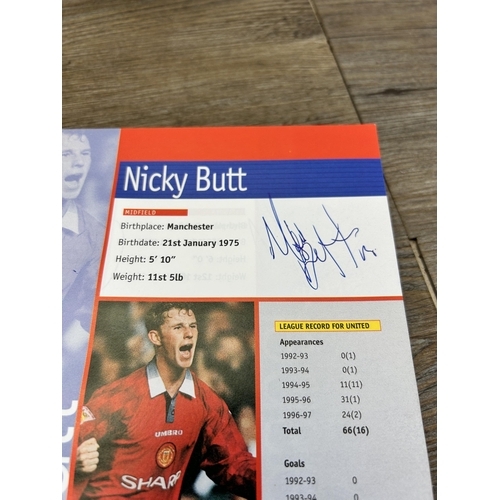 572 - A collection of 1990s Manchester United official programmes together with a signed official year boo... 