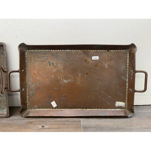 460 - Two Arts & Crafts copper twin handled trays to include Joseph Sankey & Sons etc.