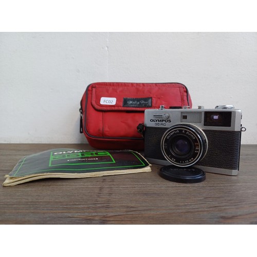 527 - A cased Olympus 35 RC compact 35mm rangefinder camera fitted with E. Zuiko 1:2.8 f=42mm lens with in... 