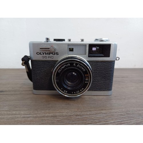 527 - A cased Olympus 35 RC compact 35mm rangefinder camera fitted with E. Zuiko 1:2.8 f=42mm lens with in... 