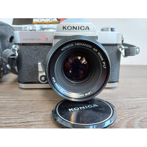 529 - A cased 1970s Konica Autoreflex T3 35mm SLR camera fitted with Hexanon AR F1.7 50mm lens with instru... 