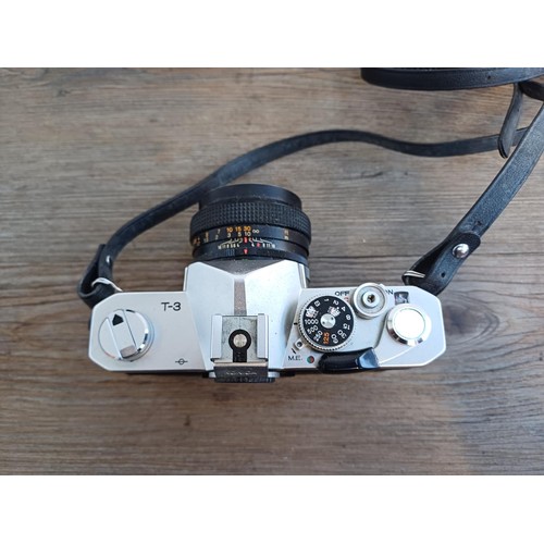 529 - A cased 1970s Konica Autoreflex T3 35mm SLR camera fitted with Hexanon AR F1.7 50mm lens with instru... 