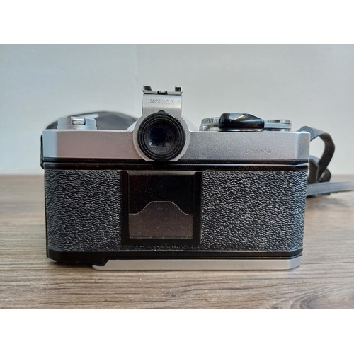 529 - A cased 1970s Konica Autoreflex T3 35mm SLR camera fitted with Hexanon AR F1.7 50mm lens with instru... 