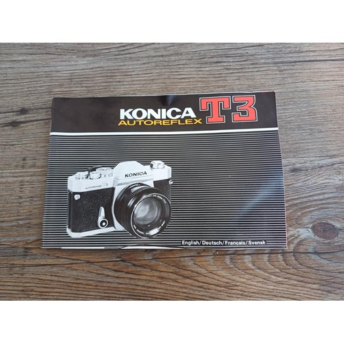 529 - A cased 1970s Konica Autoreflex T3 35mm SLR camera fitted with Hexanon AR F1.7 50mm lens with instru... 