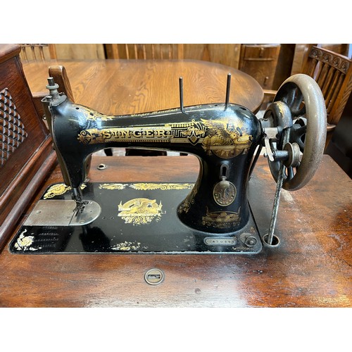 30 - A late Victorian Singer mahogany and cast iron treadle sewing machine, dated 1901 - serial no. P4703... 