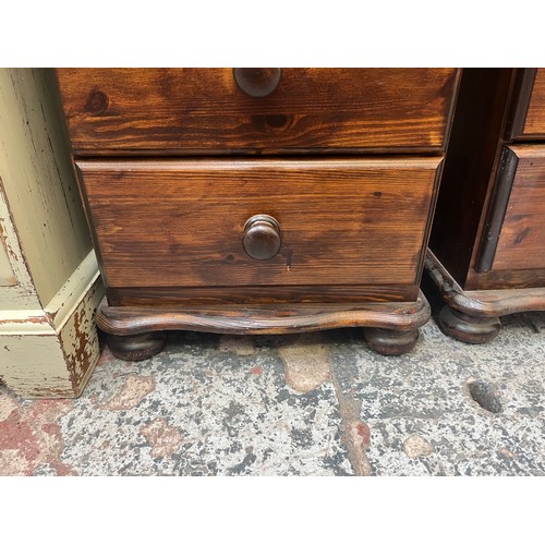 70 - A pair of pine bedside chests of drawers - approx. 67cm high x 46cm wide x 42cm deep